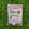 Dell 600GB 10K RPM SAS 12G 2.5-inch hard disk lying on grass.
