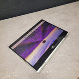 Laptop on a concrete surface with a butterfly wallpaper