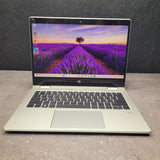 Laptop with a lavender field on the screen against a dark background
