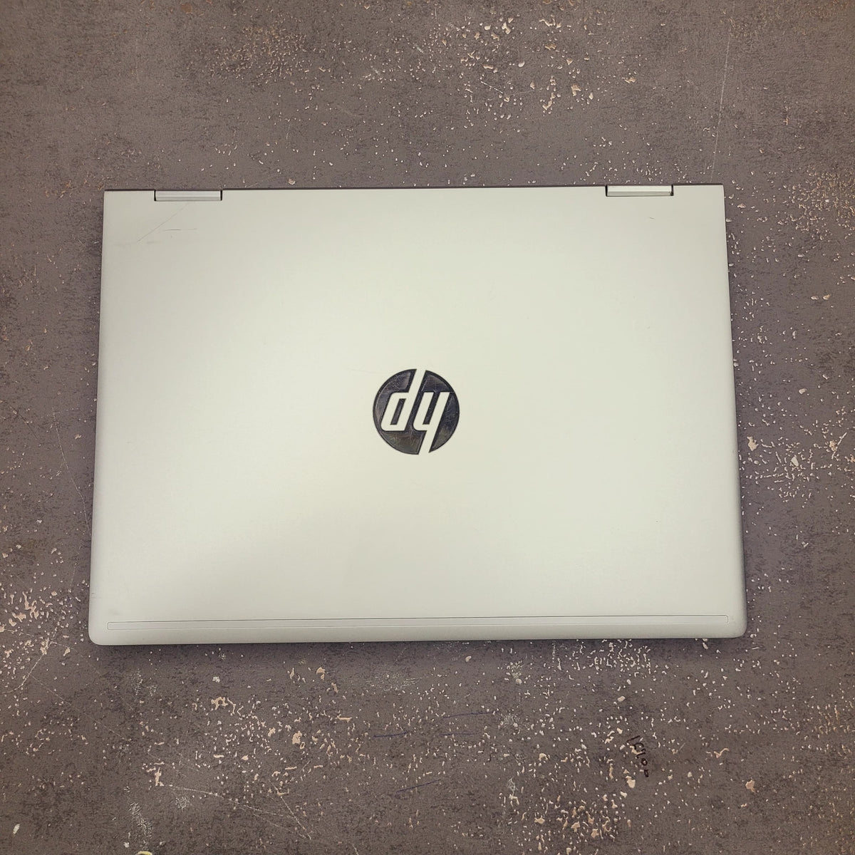 HP laptop on a textured surface