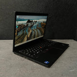 Laptop on a gray surface with a dark background