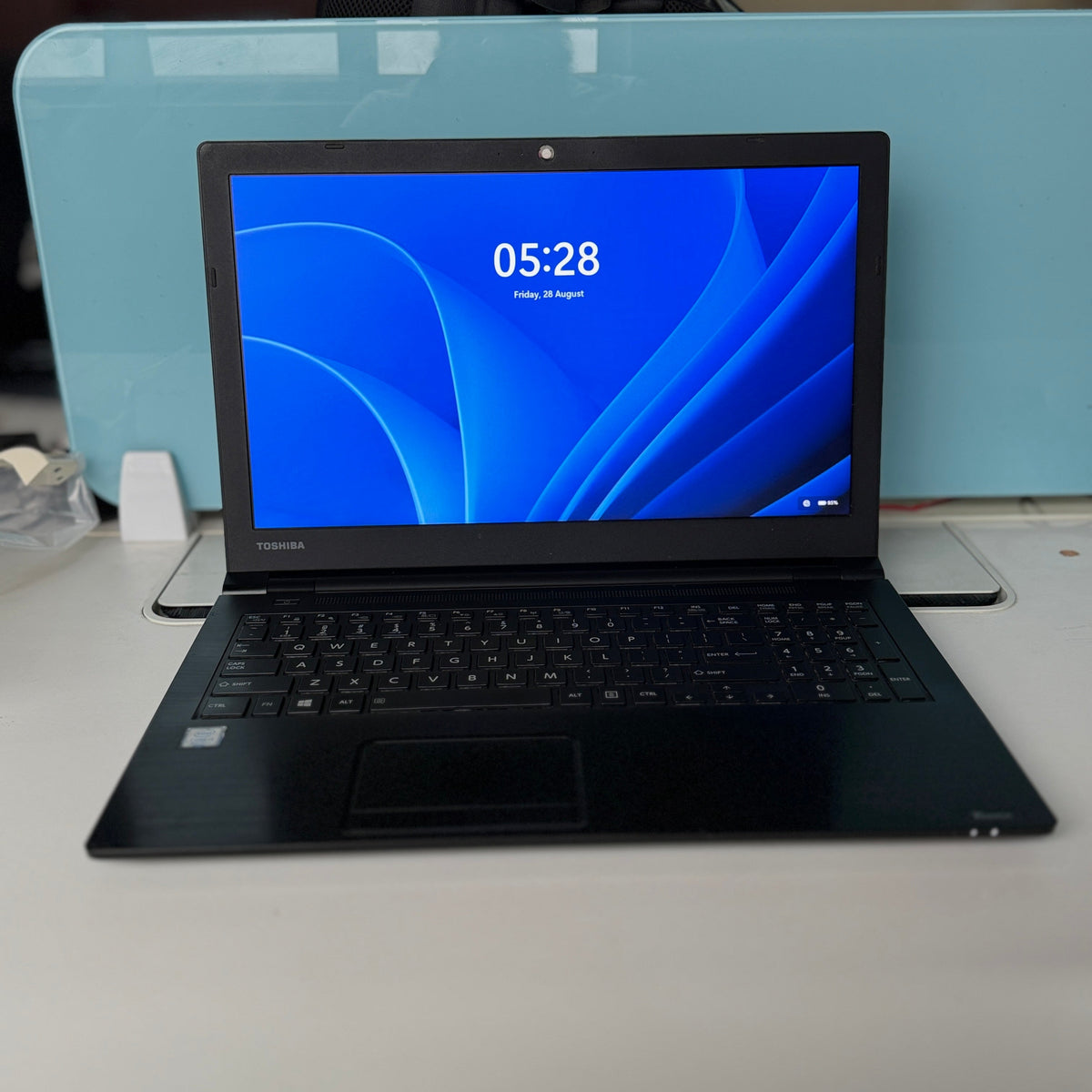 refurbished laptop displayed on table