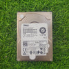Dell 1.2TB 10K RPM 12Gbps 2.5" SAS hard drive lying on grass.