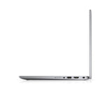 A slim silver laptop shown from the side profile with the screen open, displaying ports along the bottom edge, on a clean white background.