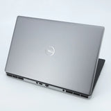 Silver Dell laptop on a light gray background