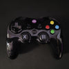 A black wireless gamepad with color-coded buttons and a directional pad, branded with 'd2i'.