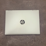 HP laptop on a textured surface