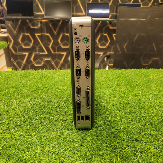 HP T628 Thin Client Computer standing on a grass-like surface,