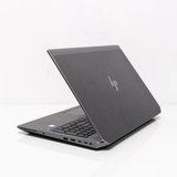 Gray HP laptop on a white background