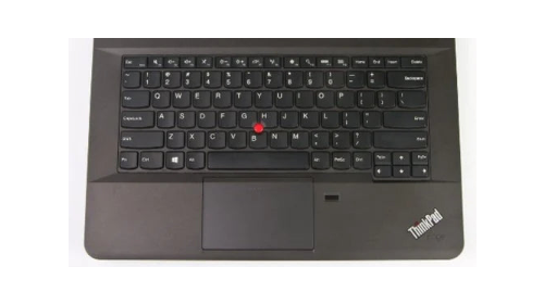 A black Lenovo ThinkPad laptop keyboard deck with a red TrackPoint nub, white lettering on the keys, and a touchpad below, shown against a plain white background.