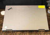Lenovo ThinkPad laptop on a wooden surface with a blurred background