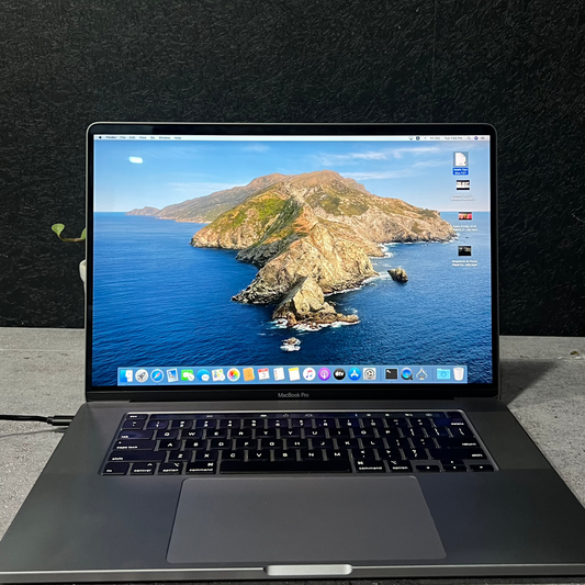 Laptop displaying an island scene on a dark textured background